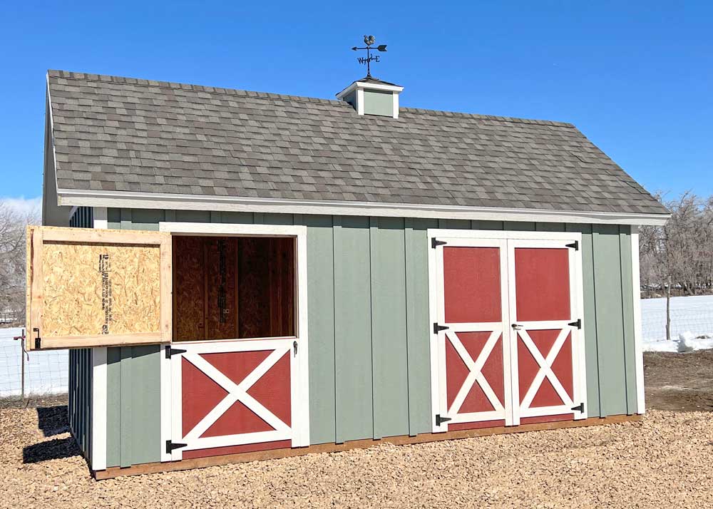 A custom shed and loafing shed combo with a dutch door, a custom roof pitch and a cupola