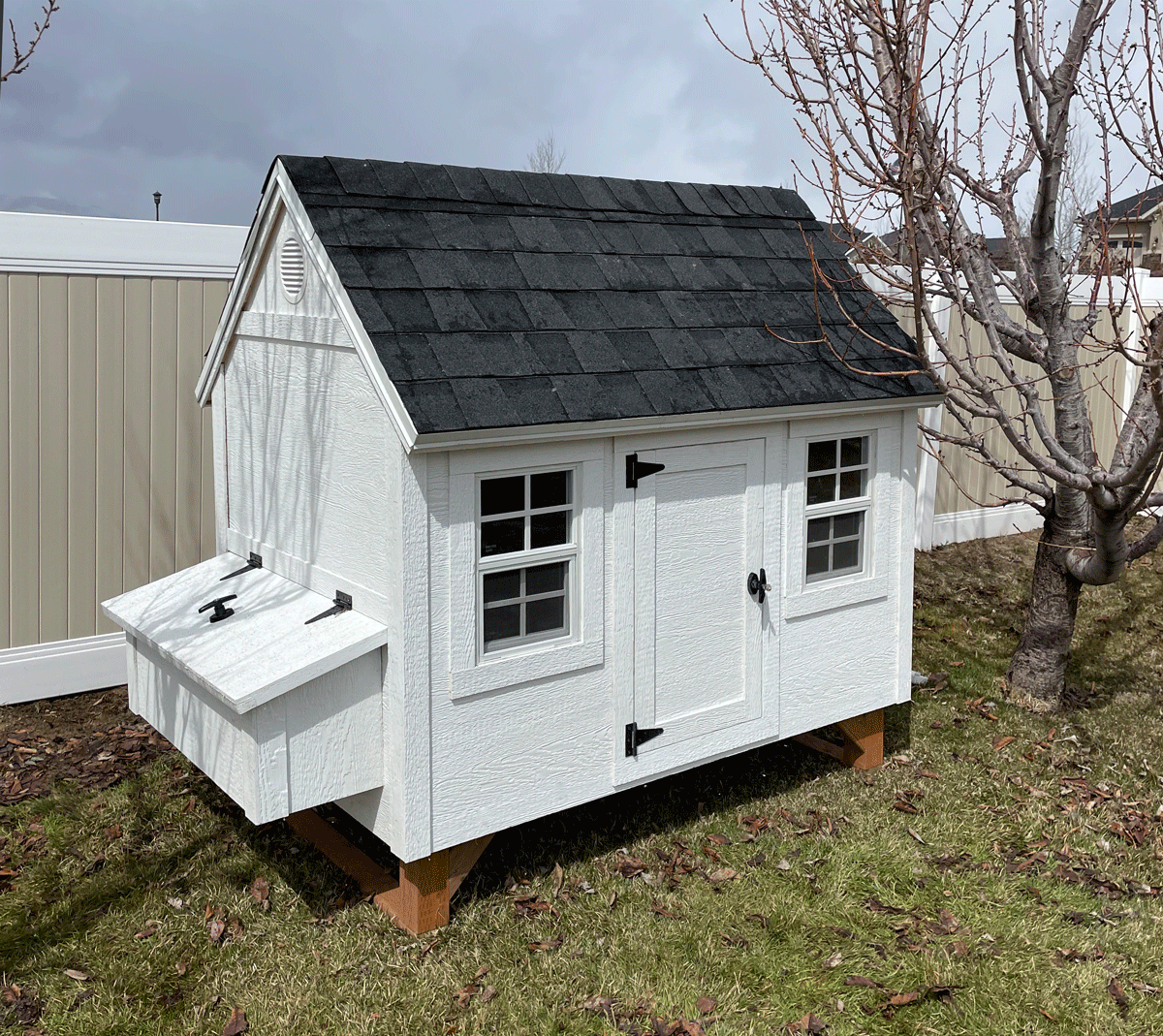 A large Hen Hut chicken coop in white and black