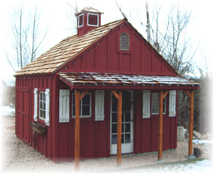 Custom apex shed with batten and board siding and cupola