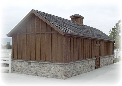 custom horse shed with cupola and batten and board siding